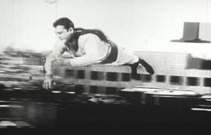 George Reeves preparing for flying shot.