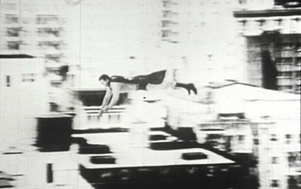 George Reeves prepares to stretch out arms.