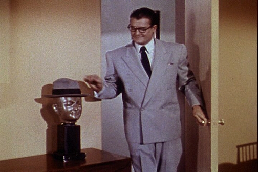 Clark is greeted by Sam as he enters his apartment.