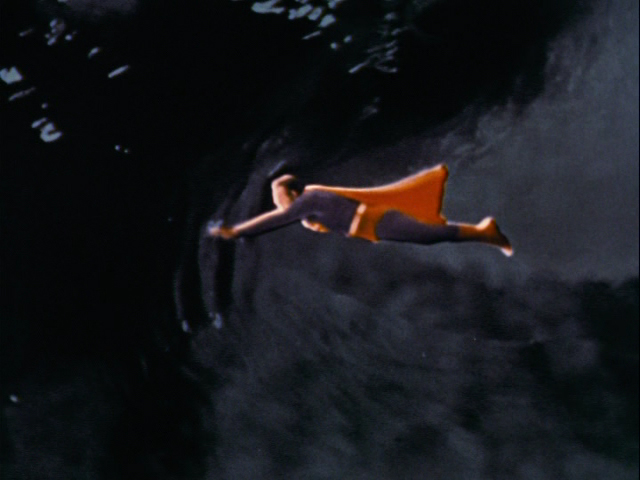 Superman flies to the surface.