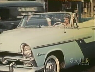 Lois behind the wheel.