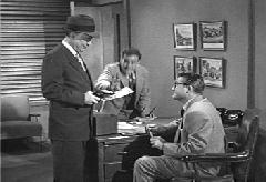 The man tries to take Alan's photo from Clark, but Jimmy rescues it and hops a ride on a subway train.