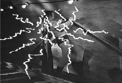 Superman stops the runaway train with Jimmy onboard.